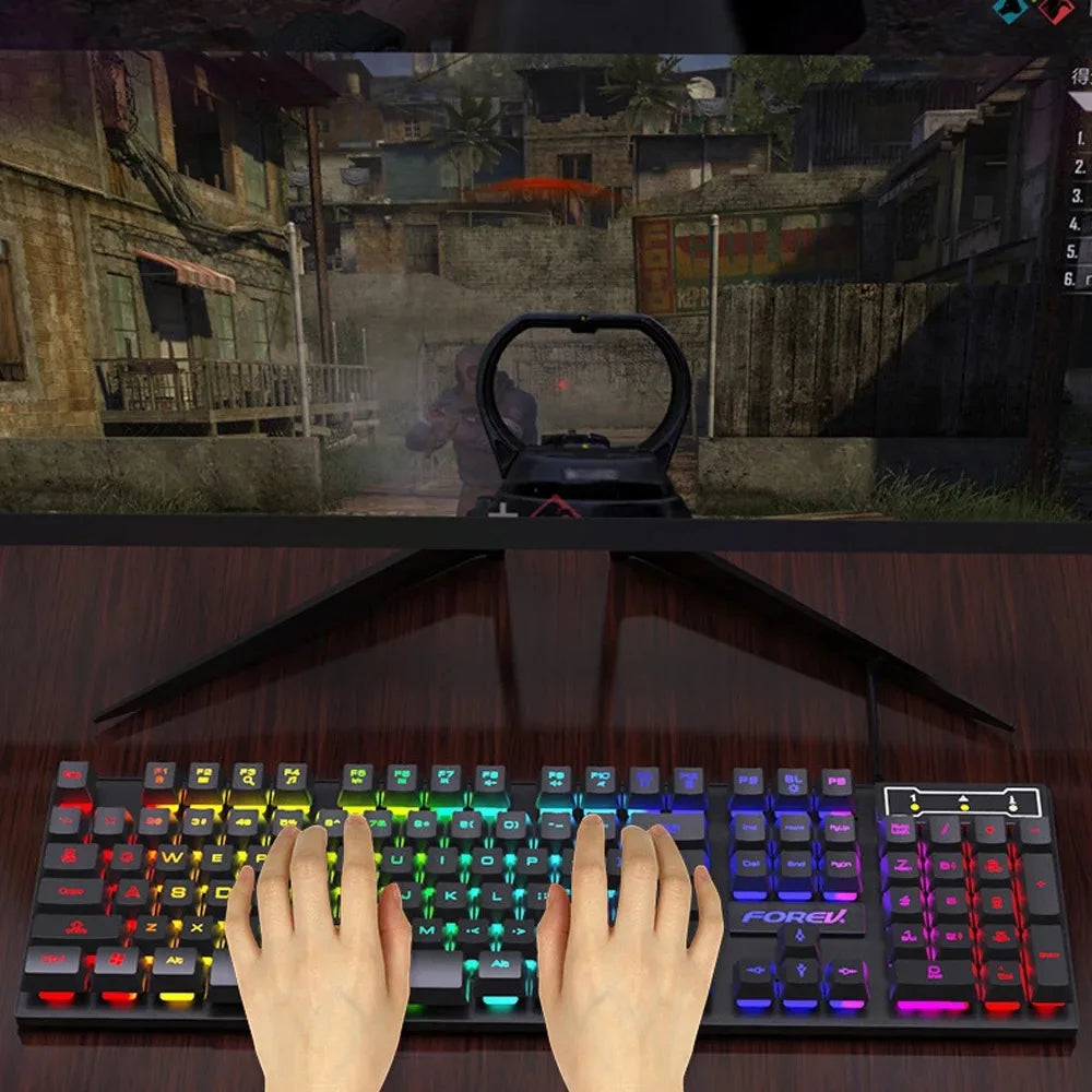 Gaming setup with a keyboard and monitor displaying a first-person shooter game.