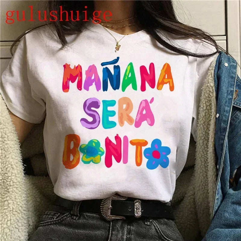 Person wearing a white t-shirt with colorful text in Spanish